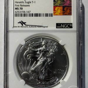 Alternative view of JAV - 2021 metų 1 doleris - "Silver Eagle" (Heraldic Eagle T-1) - NGC MS70 - FIRST RELEASES + signature John M. Merchanti - (Sidabras 999 / 31,1 g)