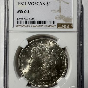 Alternative view of JAV - 1921 metų 1 doleris - "Morganas" - NGC MS63 - (Sidabras 900 / 26,73 g) – (Sesija Nr.92 – Pabaiga 20260514 – 21.34 val. + 2 min. „Anti-sniping”)